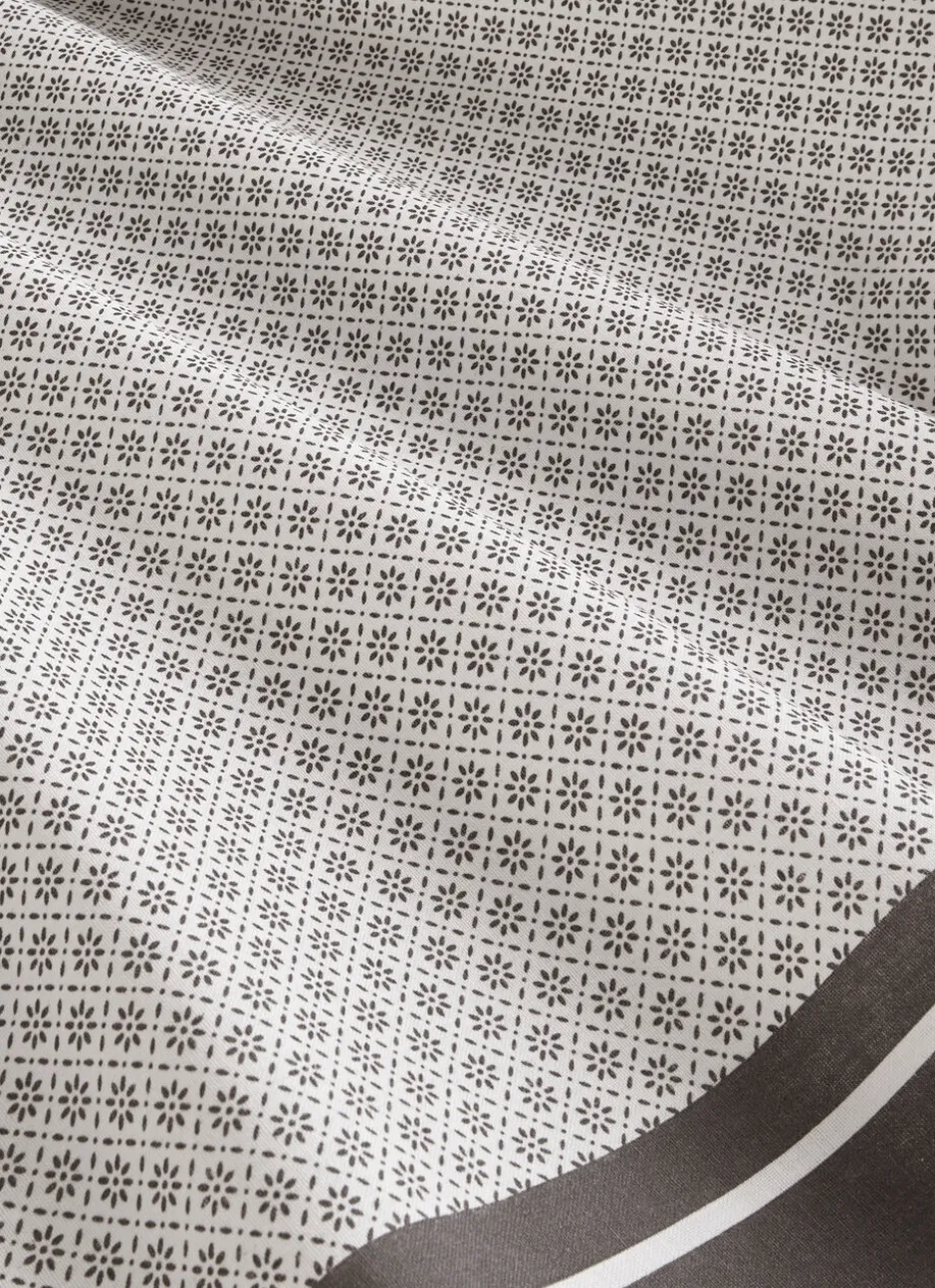 NAPPE EN COTON ENDUITE MOTIF FANTAISIE BLANC/GRIS