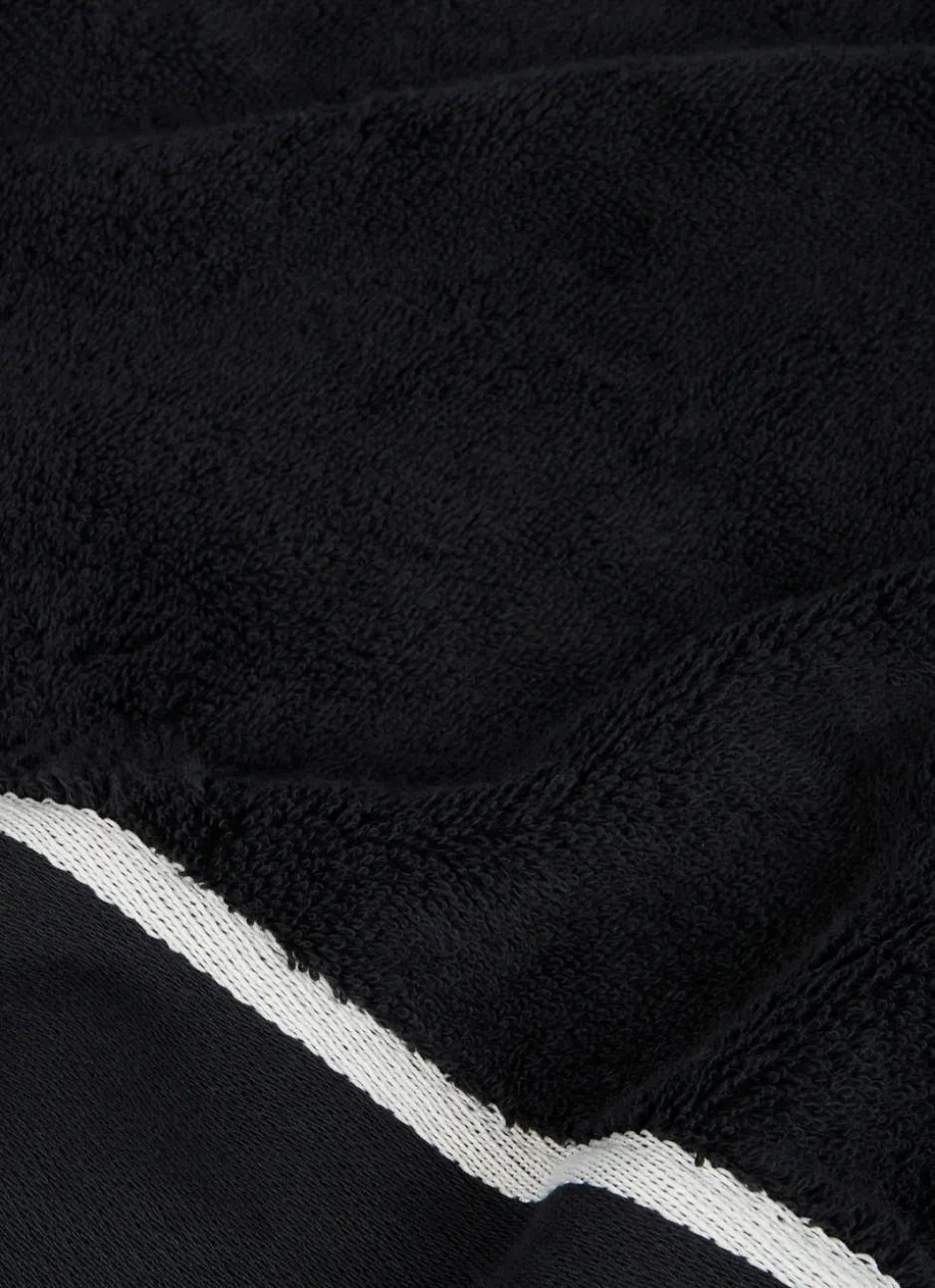 SERVIETTE DE TOILETTE UNIE À LARGE BORDURE ARTHUR Noir